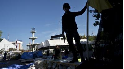 Thai soldier silhouetted near Government House, Bangkok (23 May)