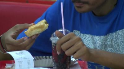 Man eating fast food in India