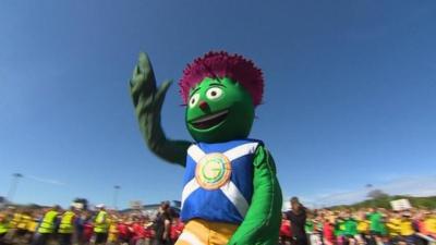 The commonwealth games mascot waves to the crowd