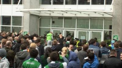 A group of Hibs fans protest after relegation from the Scottish Premiership