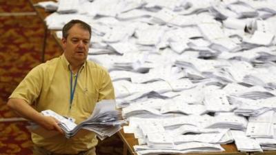 European Parliamentary election ballot papers, from the local area, are sorted as part of the count, in Southampton