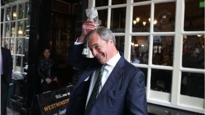 UKIP leader Nigel Farage has a pint in the Westminster Arms, London