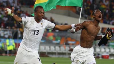 Andre Ayew (left) and John Pantsil (right) of Ghana