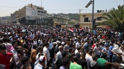 Syrians outside the Syrian embassy in Beirut