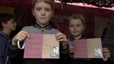 Children with souvenirs at WW1 roadshow