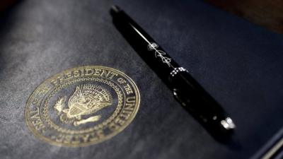 A pen used by U.S. President Barack Obama lies on an executive order prior to signing in the Eisenhower Executive Office Building January 21, 2009 in Washington, DC