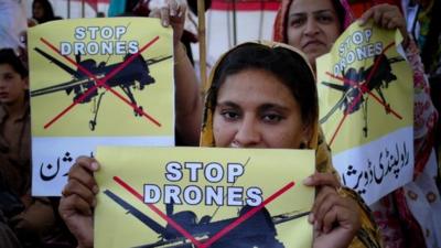 Pakistan women take part in a rally against the U.S. drone strikes in Pakistani tribal areas in Peshawar, Pakistan