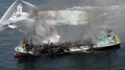 Smoke raises from the fuel tanker Shoko Maru after it exploded off the coast of Himeji, western Japan