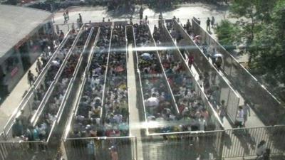 Commuters queue at a subway station in Chinese capital Beijing