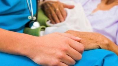 Nurse with elderly patient