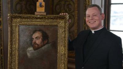 Father Jamie MacLeod with the Van Dyck art