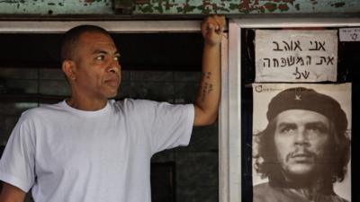 Wellington Pereira runs a barber shop in Rio's largest favela, Rocinha