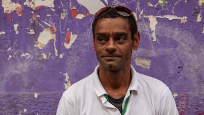 Carlos Antonio de Souza takes tourists around Rio's largest favela, Rocinha, where he grew up and lives.