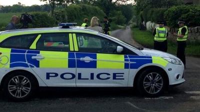 Police car near scene of the incident