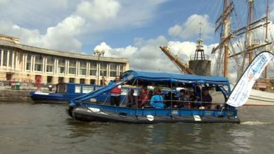 Baton arriving in Bristol on a boat