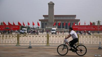 Man on bike at Tiananmen Square