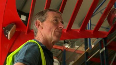 Man operating forklift truck