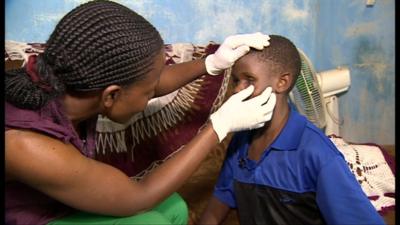Nurse treating child for pain