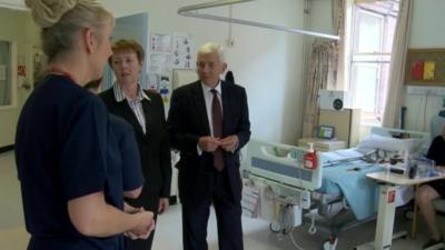 Peter Higson and Margaret Hanson talking to hospital staff