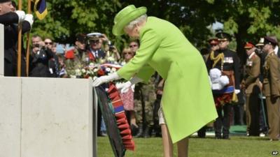 The Queen lays a wreath at Bayeux War Cemetery