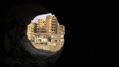 View through rubble onto buidings