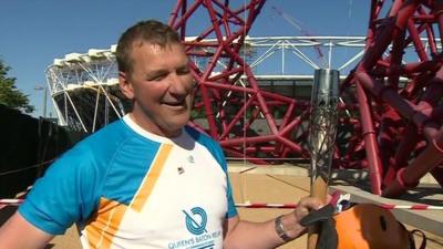 Sir Matthew Pinsent with the Queen's Baton