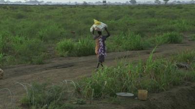 Woman walking in South Sudan