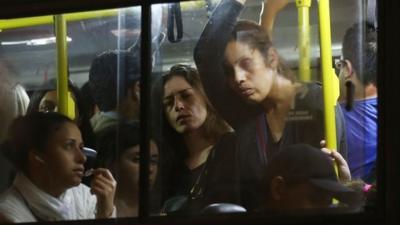 Commuters stand on a crowded bus during a tangled evening commute on June 9