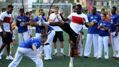 England's Daniel Sturridge (left) and Danny Welbeck dance to a samba beat