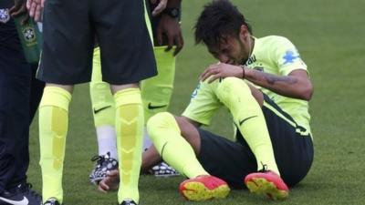 Brazil's Neymar goes down injured in training