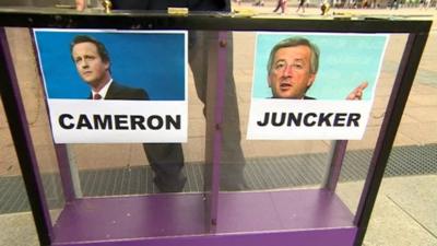 Cameron and Juncker images on mood box