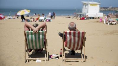 Sunbathers on a beach