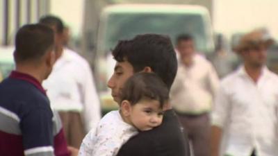 Man with child in Iraq