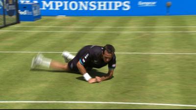 Andy Murray sends Radek Stepanek and his tennis racket tumbling to the ground