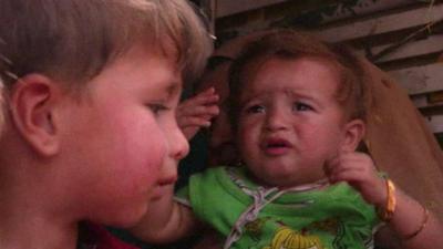 Displaced children fleeing Irbil, Iraq