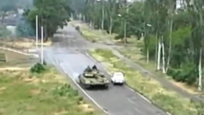 Amateur footage of a tank on a road