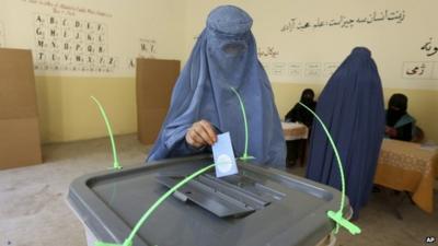 Woman casts ballot in Jalalabad