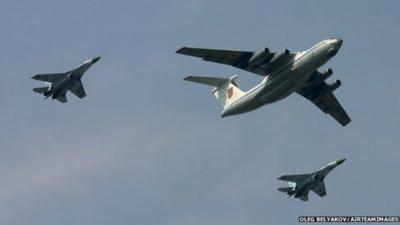 An Ukrainian Il-76 aircraft flanked by two Su-27s during a military parade - 24 August 2008