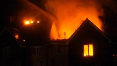 A neighbour filmed the the fire on his mobile phone while his family looked on