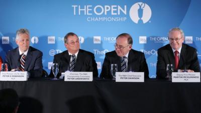 Northern Ireland First Minister Peter Robinson and Deputy First Minister Martin McGuinness with R&A chief executive Peter Dawson and Open Championship committee chairman Peter Unsworth at Monday's announcement