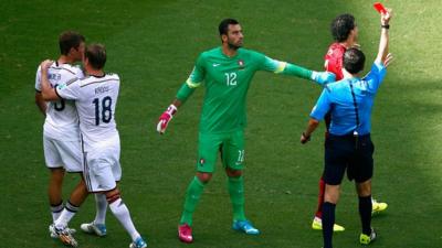 Portugal's Pepe is shown a red card