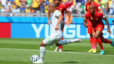 Algeria's Sofiane Feghouli gives his side the lead from the spot against Belgium