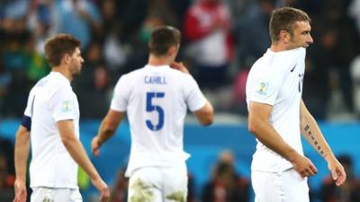 England players look dejected after they lose 2-1 against Uruguay at the 2014 World Cup