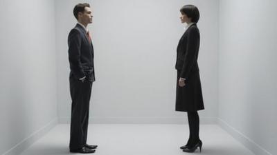 A man and woman standing up