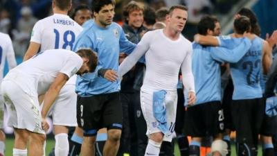 Luis Suarez consoles Wayne Rooney