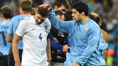 Luis Suarez consoles Steven Gerrard
