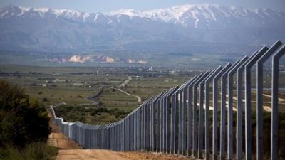 The Israeli border with Syria is seen on the Israeli side of the annexed Golan Heights near Quneitra on April 24 201