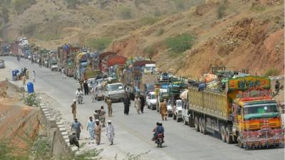 A line of vehicles as Pakistani civilians, fleeing a military operation in North Waziristan