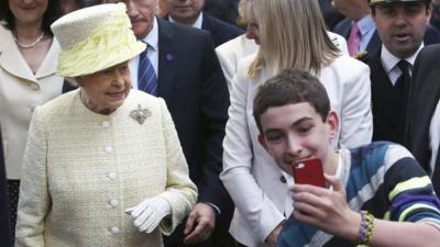 Boy takes 'selfie' with Queen