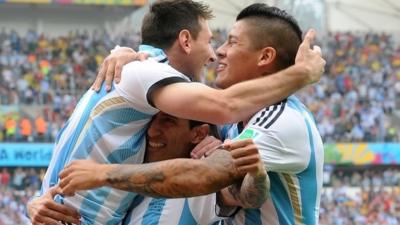 Argentina goalscorers Lionel Messi (left) and Marcos Rojo (right) celebrate with Angel Di Maria